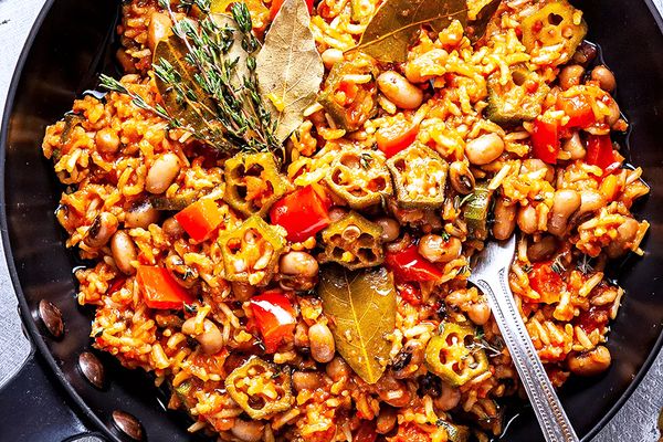A pot of Jollof rice on a stove.